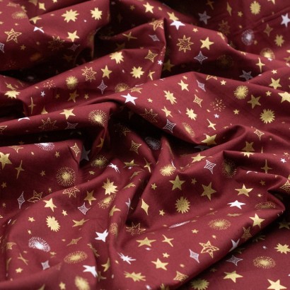 Tela de navidad estrellas y destellos textura granate