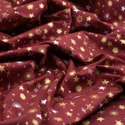 Tela de navidad estrellas y destellos textura granate