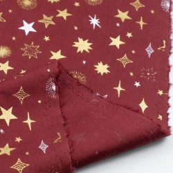 Tela de navidad estrellas y destellos revés granate