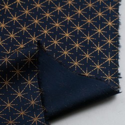 Tela de navidad estrellas geométricas revés