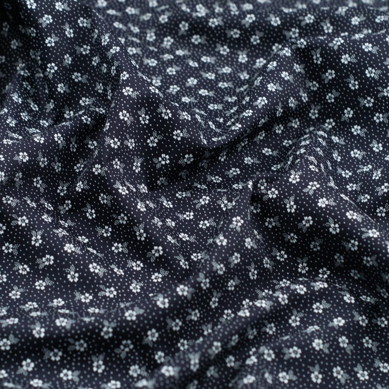 Tela de algodón flor y topos detalle azul marino