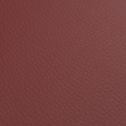 Tela de polipiel tapicería con textura lisa granate