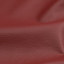 Tela de polipiel tapicería con textura detalle granate