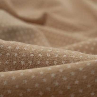 Tela de algodon estrellitas detalle beige
