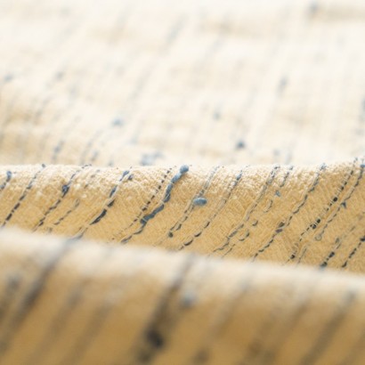 Tela tipo tweed con blucles detalle