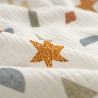 Tela de musalina estrellas y rayos detalle