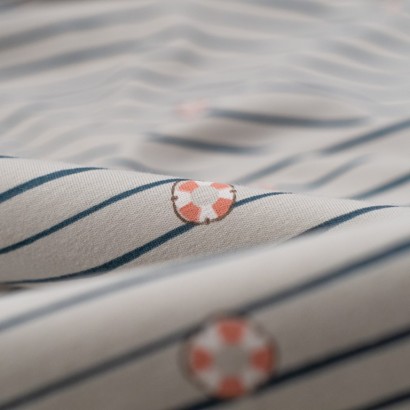 Tela de punto camiseta rayas y boyas detalle