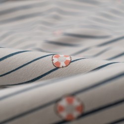 Tela de punto camiseta rayas y boyas detalle