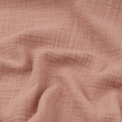 Tela de muselina con trama textura rosa palo