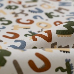 Tela de popelín letras de dinosaurios detalle
