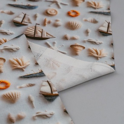 Tela ded popelín barcos en relieve revés