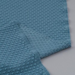 Tela de punto bodoques revés azul turquesa