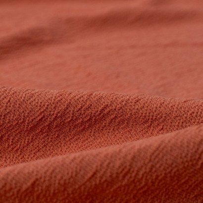 Tela de punto crepe detalle rosa viejo