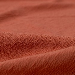 Tela de punto crepe detalle rosa viejo