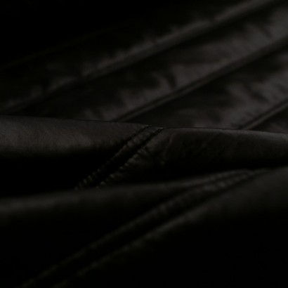 Tela de impermeable acolchado doble pespunte detalle