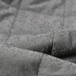 Tela de impermeable acolchado rombo detalle