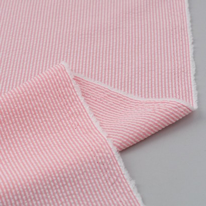Tela de seersucker mil rayas reves rosa fluor